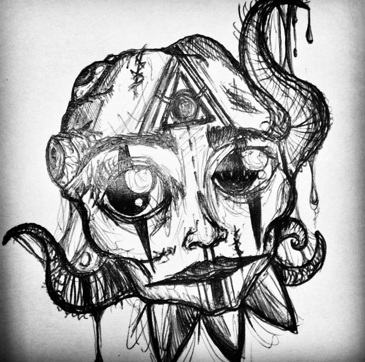 Volto da clown con il terzo occhio, penna nera